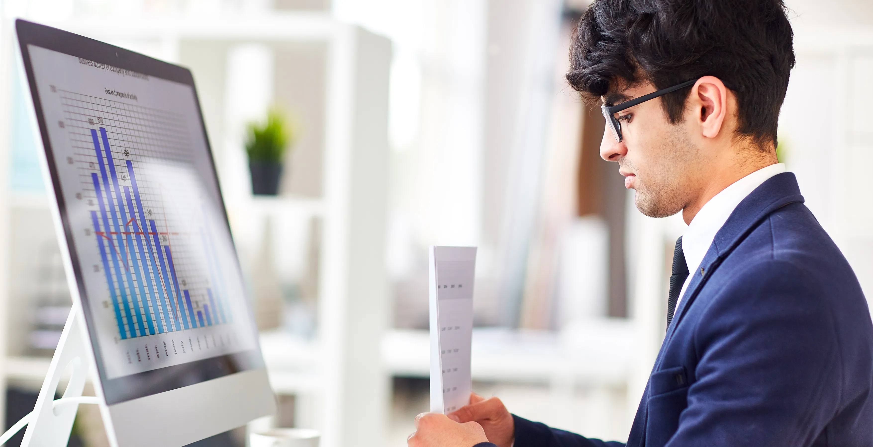 Professional reviewing financial plans to improve savings and investments